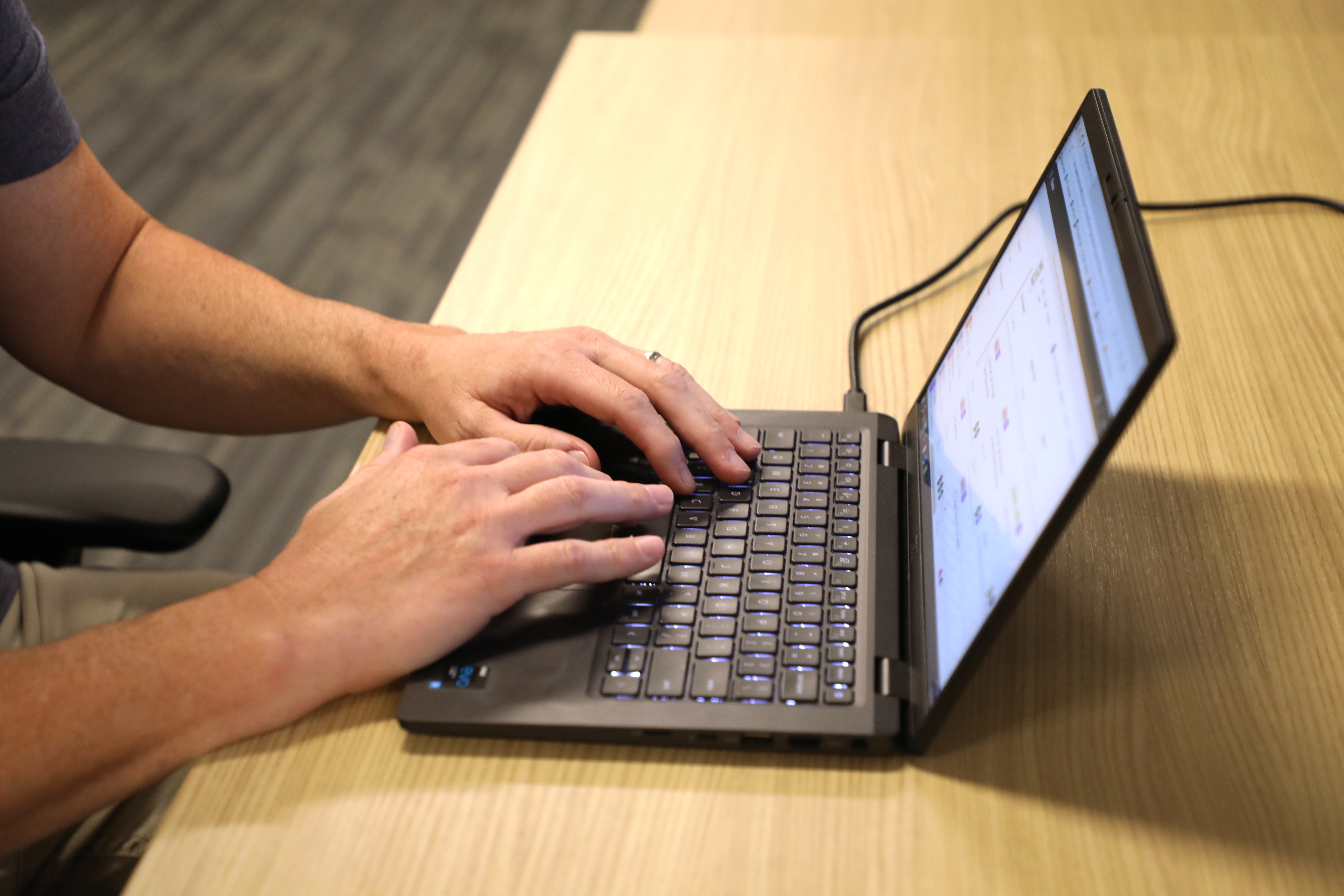 Person typing on computer